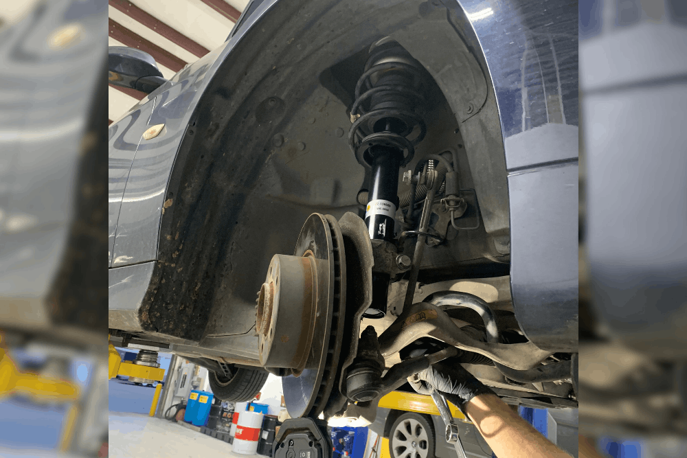 Brakes and suspension issues, auto repair in Mooresville, NC by Rock Solid AutoCare. Image of a vehicle’s suspension, brake rotor, and strut assembly during inspection, highlighting professional diagnostics and repairs to ensure safe handling, smooth ride quality, and reliable braking performance.